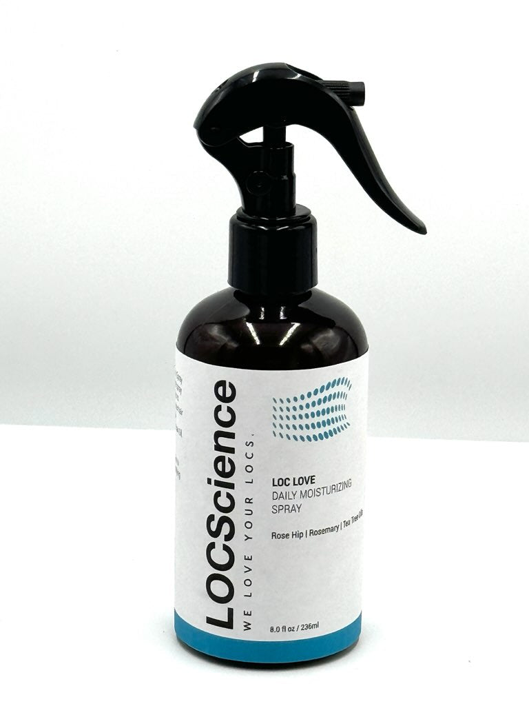 LOC LOVE Daily Moisturizing Spray product photo prompt: a sleek fine-mist spray bottle labeled LOC LOVE Daily Moisturizing Spray on a bright neutral bathroom vanity with soft linen, a wooden comb, and a subtle plant stem; mist droplets visible in soft light; clean luxury haircare editorial product photography, diffused lighting, shallow depth of field.
